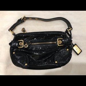 The Original Car Shoe owned by Prada bag